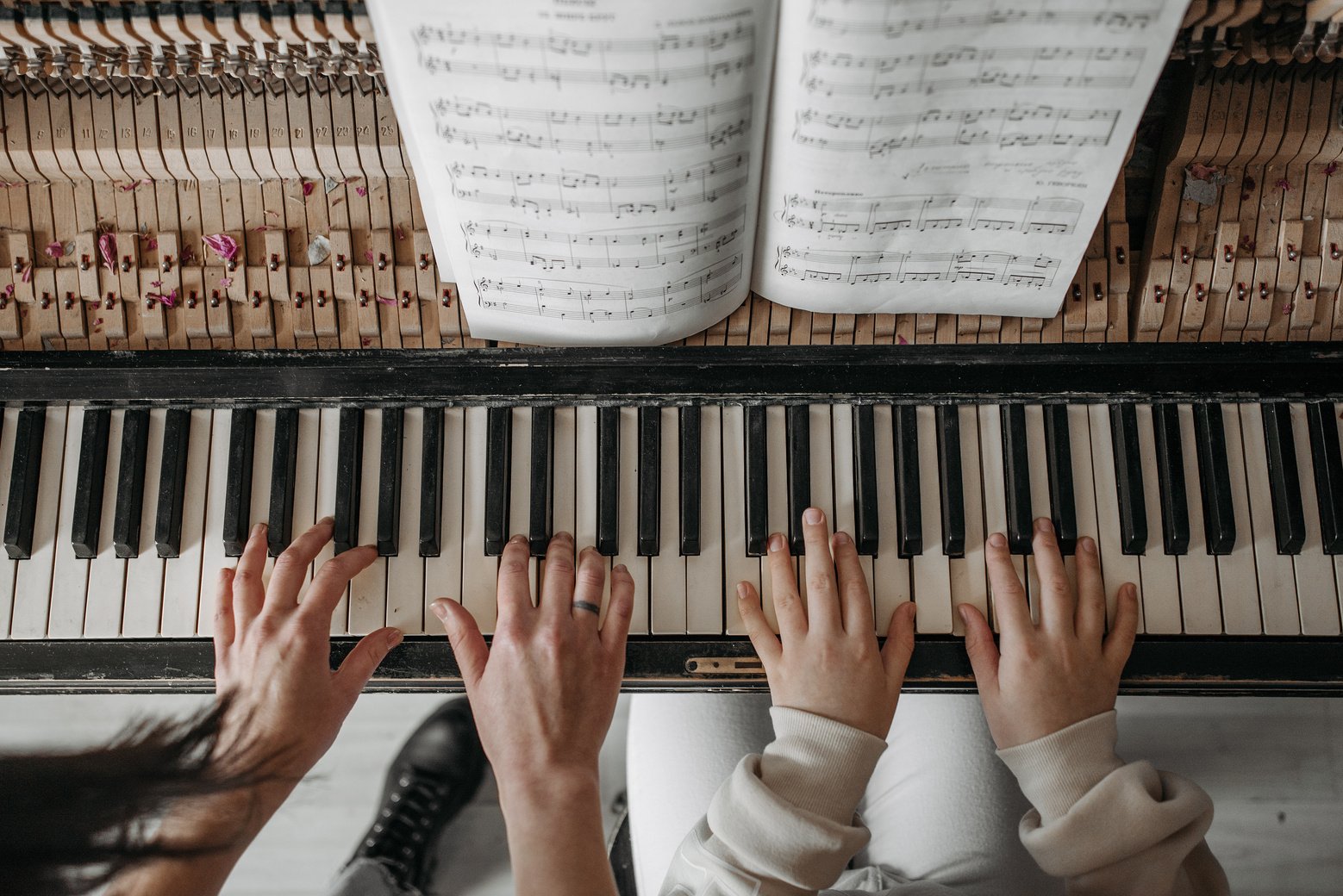 Person Playing Piano With Musical Notes